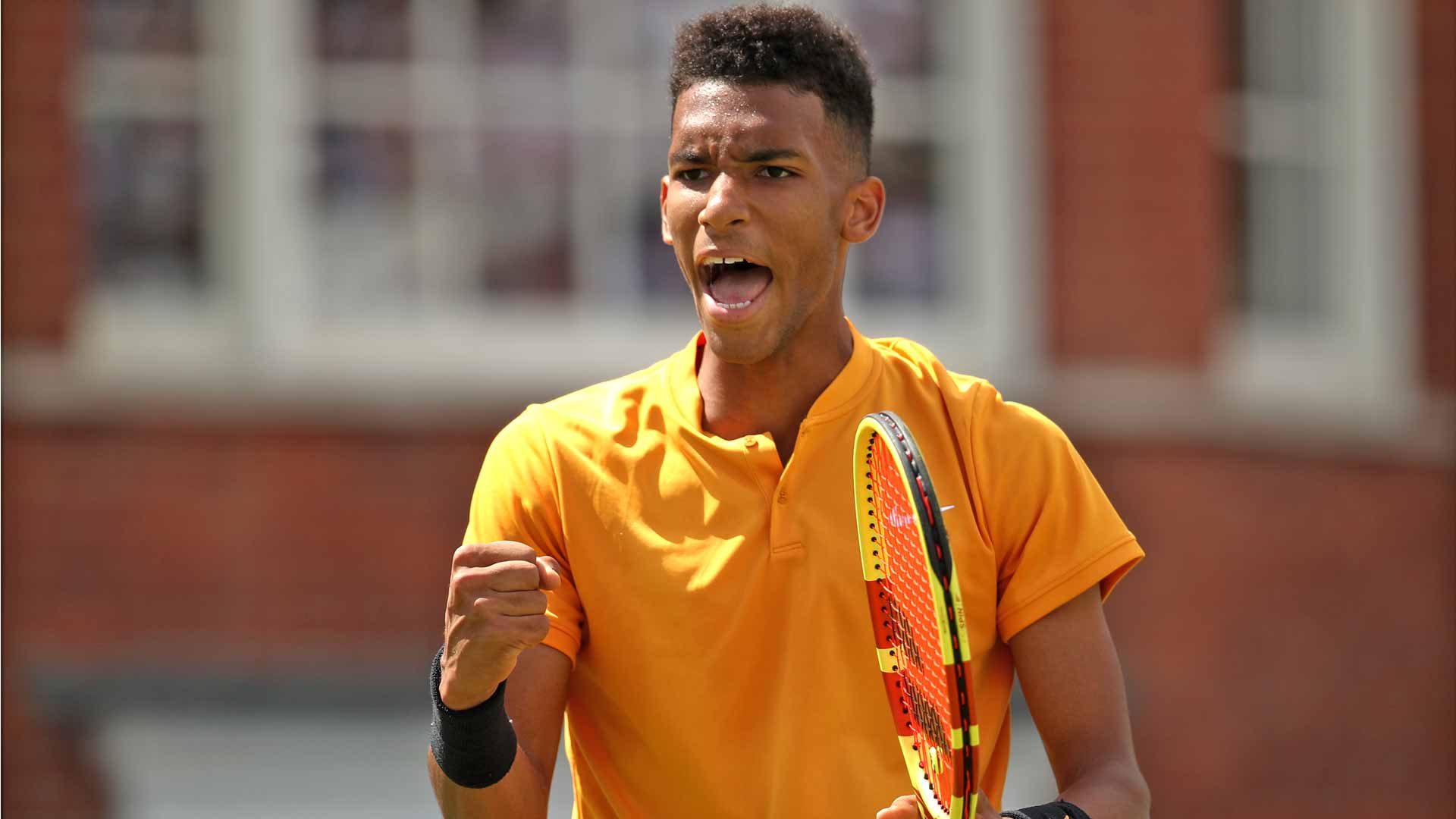 Felix Auger-Aliassime reacts against Stefanos Tsitsipas in Queen's Club 2019
