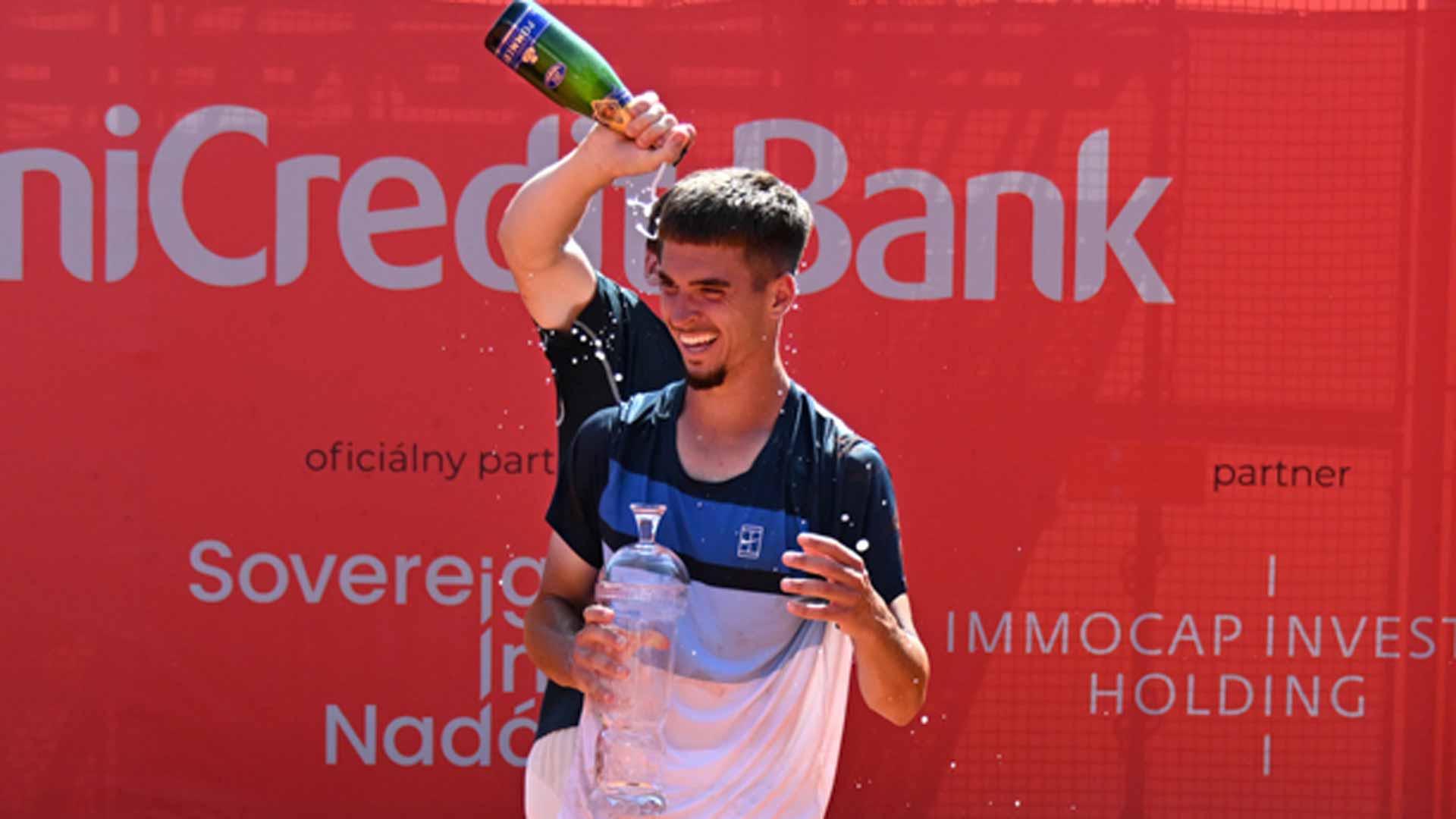 Dino Prizmic in Bratislava, where runner-up Valentin Royer helps the Croatian with a champagne celebration.