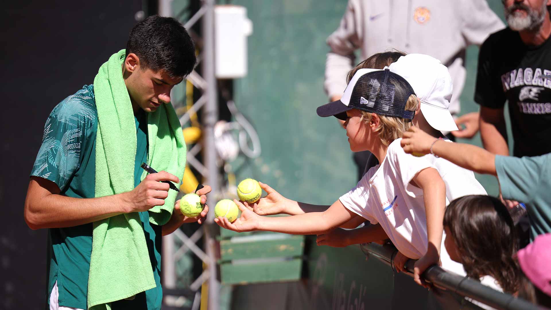Luka Mikrut signs autographs following his title run at the Braga Challenger.